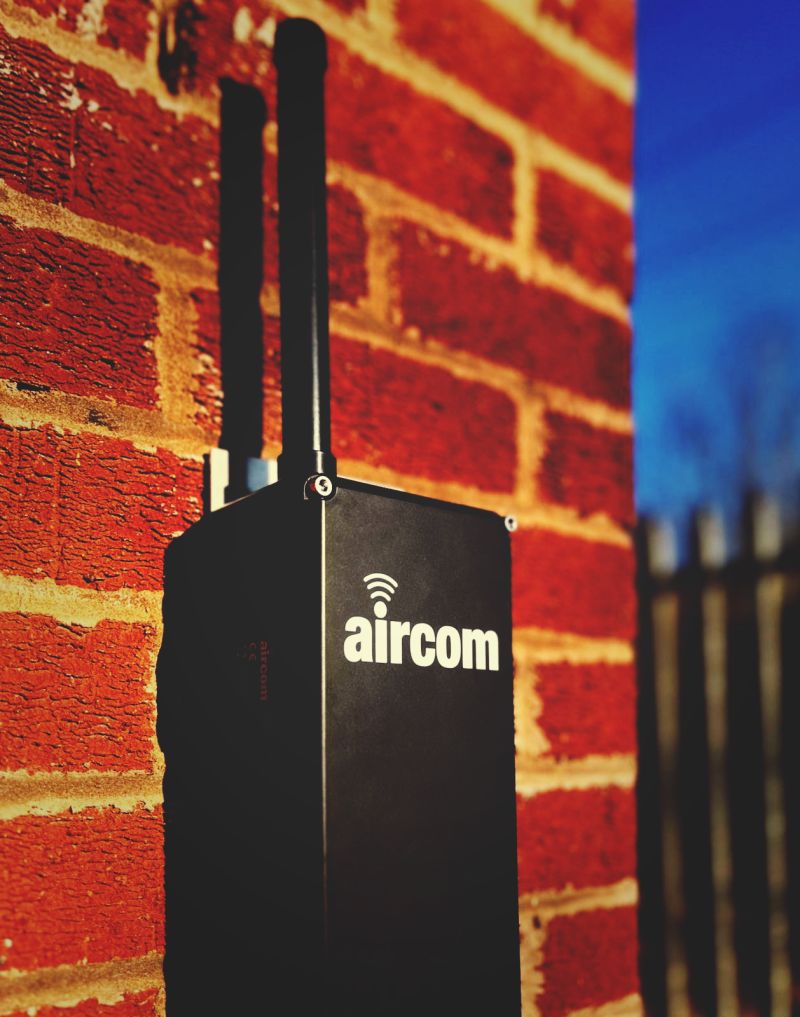 Aircom-sunshine-brick-wall-blue-sky